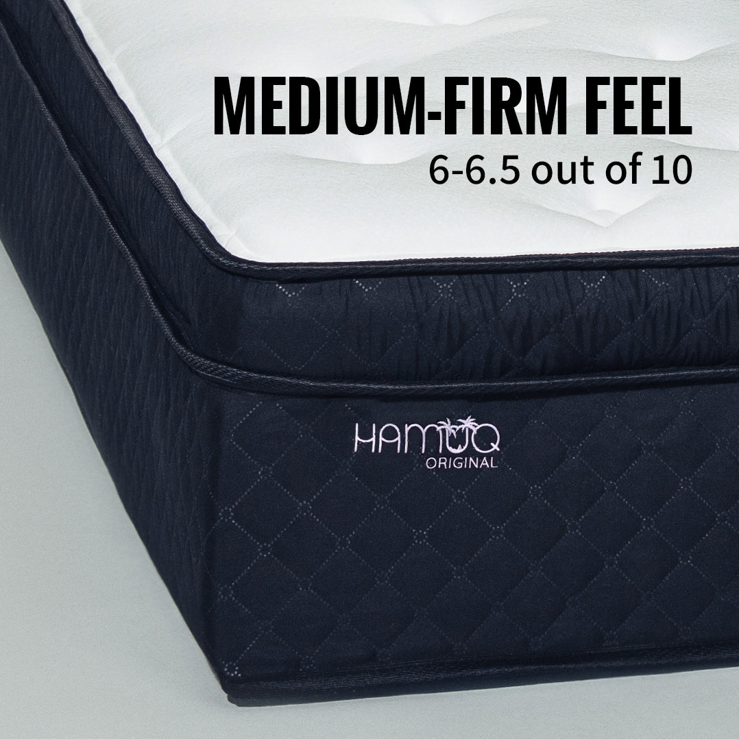 Corner of the Hamuq Original Hybrid mattress with the label Medium-firm feel, 6 to 6.5 out of 10