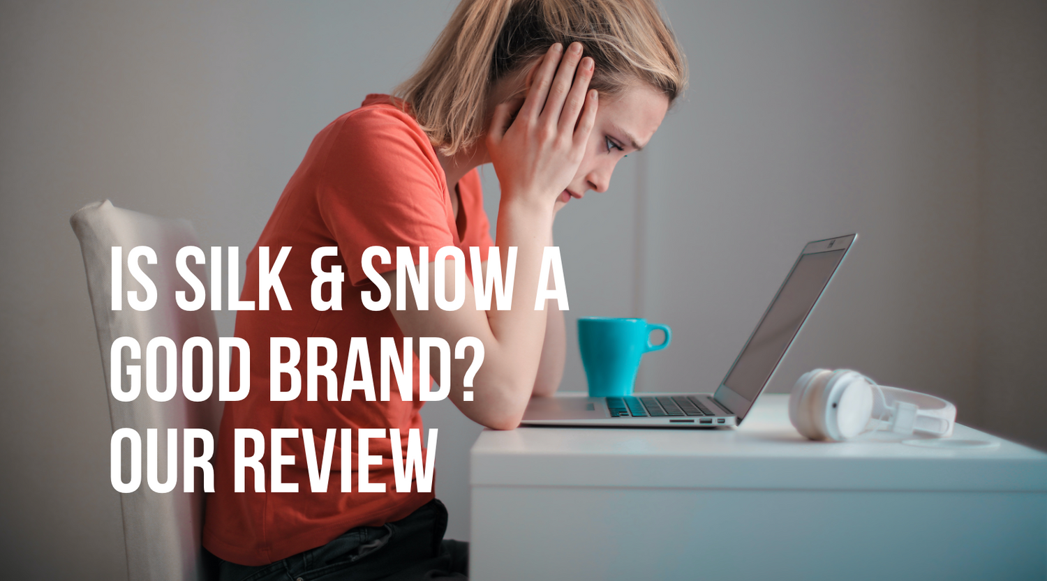 Woman researching Silk & Snow mattress reviews on a laptop